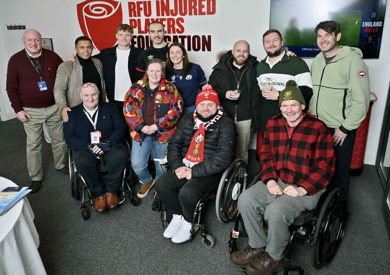IPF Ambassadors Fin Smith and Jason Robinson with IPF Members at England v Wales in Guinness Men's Six Nations
