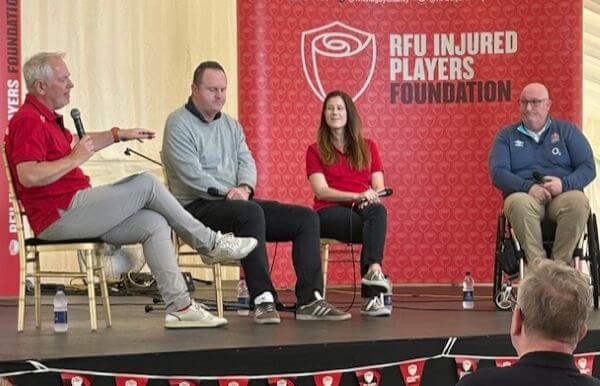 Karen Hood and John Burgess of the IPF, Nick Mullins and IPF Member Alex Bennett on stage